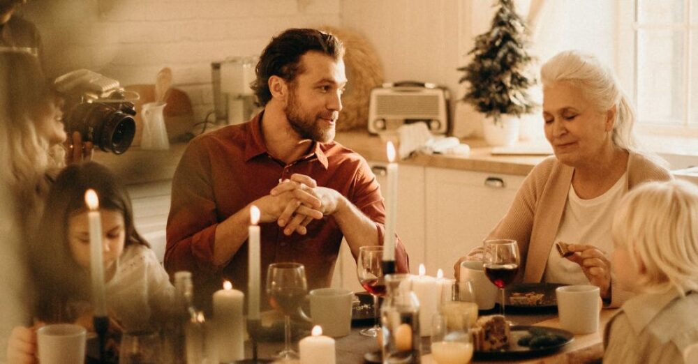 Traditions - People Sitting Beside Table