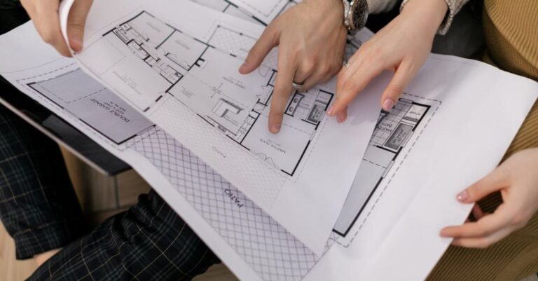 Schemes - Hands Holding Sketches of House Project