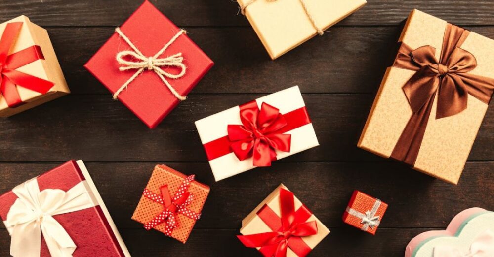 Gifts - Wrapped Gift Boxes With Ribbons on Table