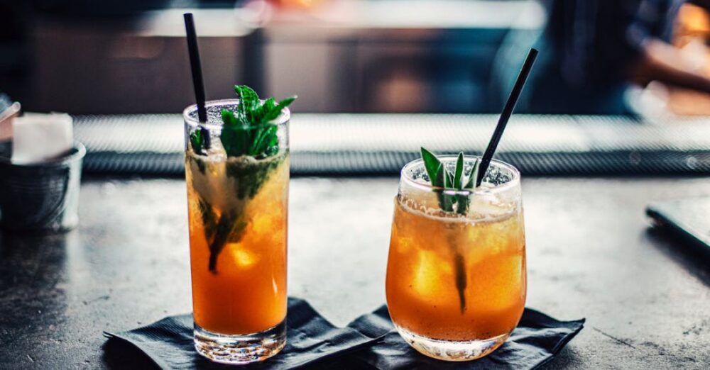 Cocktails - Two Brown Liquid Inside Clear Drinking Glasses